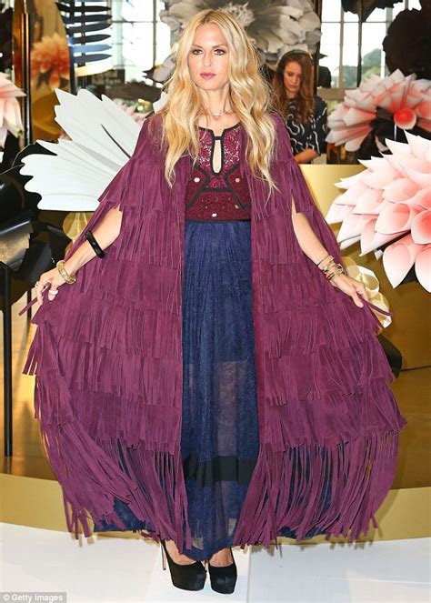 rachel zoe burberry cape|Rachel Zoe in a heavy fringed leather cape as she at breakfast .